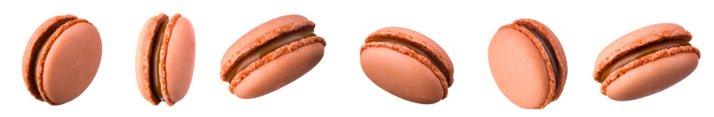 Macro photo of french caramel macaroon isolated on white background