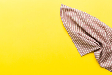 top view with red empty kitchen napkin isolated on table background. Folded cloth for mockup with copy space, Flat lay. Minimal style