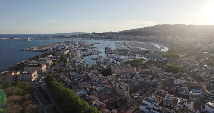 Marina At Puerto de Palma With Llotja de Palma In Foreground. Balearic Islands, Spain. aerial panning shot