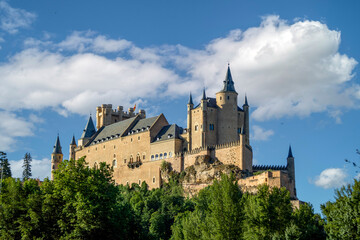 Fototapeta premium View of the spectacular Alcázar of Segovia from the Eresma river promenade, Segovia, Castilla y Leon, Spain