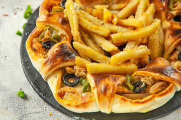 Chicken Fajita stuffed naan served with french fries, Pakistani fusion food.