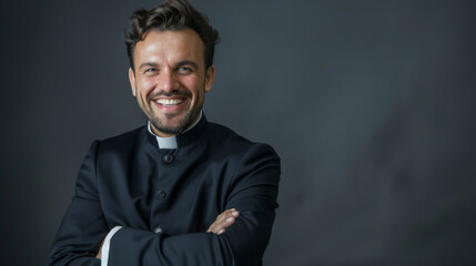 Fototapeta premium A man in a black suit and a white collar is smiling