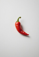 Chili pepper, minimalist shot, food photography, clean simple background, advertising shot, volumetric light, white background