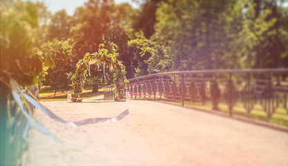 Beautiful Outdoor Wedding Ceremony Setup with Decorative Arch and Floral Arrangements