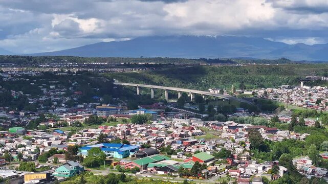 Aerial View of Puerto Montt, Chile, Residential Neighborhood. Buildings and Bridge Traffic 60fps