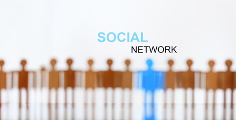 Social network sign above line of toy human figures concept