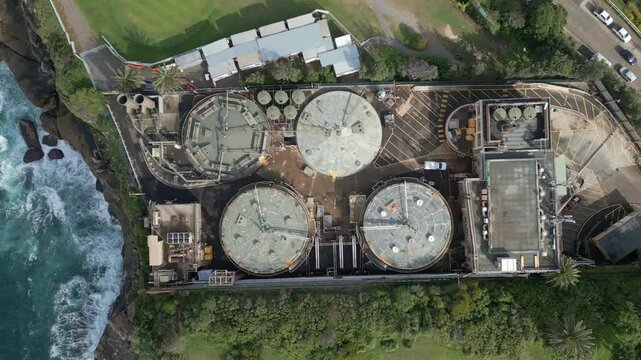Water treatment plants, wastewater treatment site to remove chemicals and contaminants. tap water industry facility for consumption. Aerial top down shot and bird eye view.