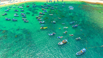 Fototapeta premium Fishermen's boats moored in Nhon Hai sea, Binh Dinh province, Vietnam. View from above
