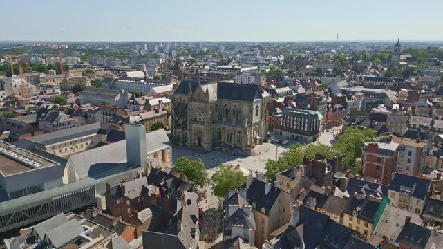 Basilica Saint-Aubin in Place Sainte Anne square and Jacobins convent, Rennes in France. Aerial drone backward