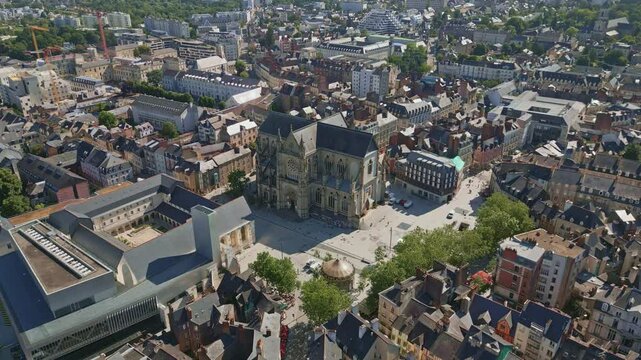Basilica Saint-Aubin in Place Sainte Anne square and Jacobins convent, Rennes in France.  Aerial drone top-down forward descending