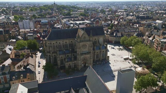 Basilica Saint-Aubin in Place Sainte Anne square, Rennes in France. Aerial forward