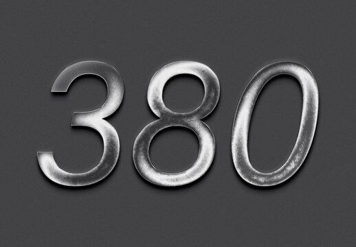 Chrome metal 3D number design of 380 on grey background.	