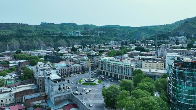 drone shot for old tbilisi with old houses and nature at the afternoon at the beggining of summer