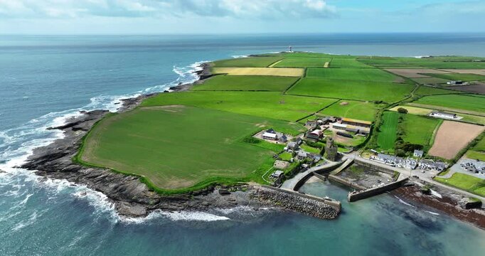 Ireland Epic locations Drone landscape Hook Head Wexford,Slade Village with Hook Lighthouse in the background on a bright summer day
