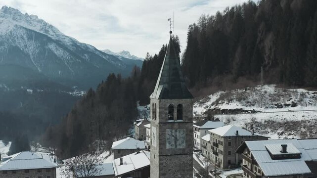Tracking Bell Tower In An Old World Misty Mountain Valley Village.