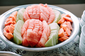 Fresh watermelon and melon slices served on an elegant dish
