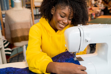 African american girl in her sewing workshop.