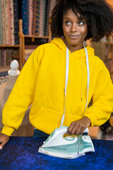 African-American girl in her sewing workshop.