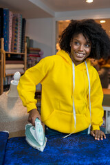 African-American girl in her sewing workshop.