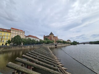 water view with dramatic sky in prague, czech republic