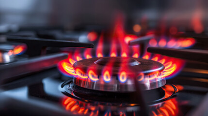 сlose up of a kitchen burning gas stove with red fire flame