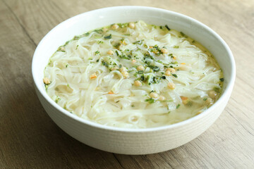 Cooked instant noodles in white bowl