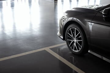 close up of modern car in parking lot, anti slip coating floor for safety