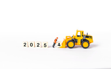 Miniature worker with wooden cube isolate on white background, happy new year 2025 