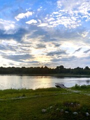 View at sunset with a wooden dock extending into the calm water. Wonderful landscape