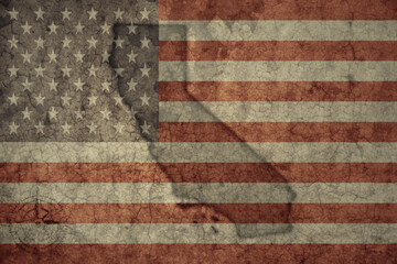 map of california state and flag of united states of america on a old vintage crack paper background .