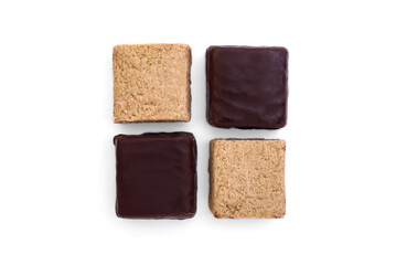 Halva sweets in chocolate isolated on white background.