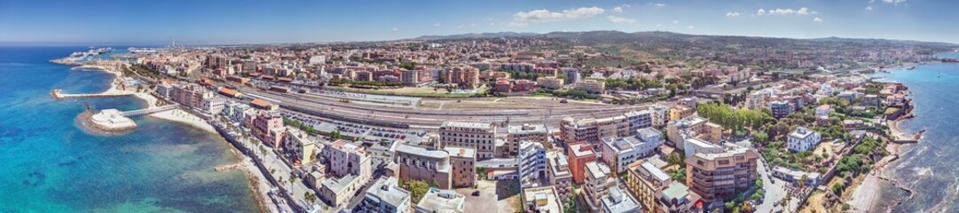 Drone panorama over the Italian city of Civitavecchia with harbor and cruise ships during the day