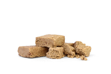 Piece of halva isolated on white background.