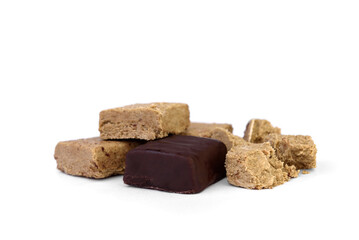 Halva sweets in chocolate isolated on white background.