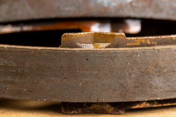 an old rusty brake disc from the car's brake system