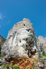 Perun rock of the Spis Castle in Slovakia with traces of lightning strikes