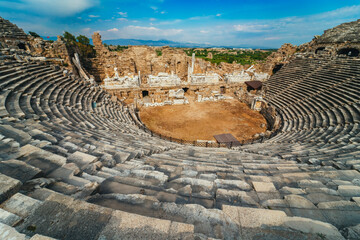 Naklejka premium Aspendos, Antalya. Spectacular cloudscape accompanying the panoramic view of the Roman Theater in Turkey.