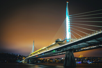 Golden Horn Metro Bridge. Photograph of the modern metro bridge taken at sunset over the estuary in Istanbul, Turkey.