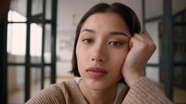 Point of view POV webcam tired bored girl hispanic latin woman addict using mobile phone touch screen smartphone addiction overuse social media scrolling browsing internet boring lazy female rest home