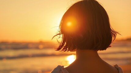 Serene Woman with Chic Bob Haircut Admiring Sunset on Beach with Copy Space, Blurry Background