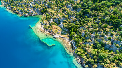 View of Kaleköy village in Antalya's Kekova district from a drone. Aerial view of the underground city under the sea in Kekova with a drone.