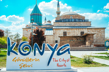 Mevlana Tomb and Mosque in Konya. View of the Mevlana Museum with the Konya inscription in front of...
