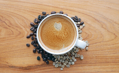 Crema espesso coffee cup, espresso  coffee and coffee bean on wooden table