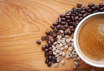 Crema espesso coffee cup, espresso  coffee and coffee bean on wooden table