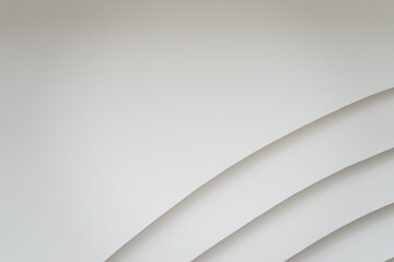 A white background with a series of lines. The lines are curved and appear to be in a wave pattern. The image has a clean and minimalist feel to it