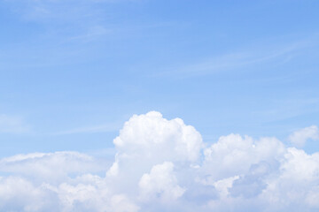 Sky blue and white big hunk lump cloud obscuring sun beautiful with bright sunlight nature background. Take photo panorama.	Abstract texture background. Space to enter text between sky and clouds.