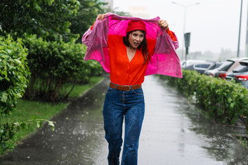 Stressed woman covering head with clothes without a hood