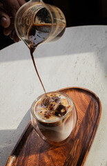 cup of coffee with chocolate and ice on the table
