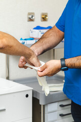 Healthcare Workers Preparing with Sterile Gloves