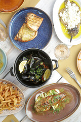 Various Mediterranean dishes served on the restaurant table	